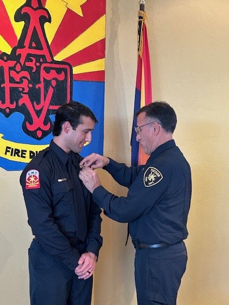 Firefighter Leon receives his badge 2-26-26