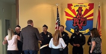 Northwest Hospital presents challenge coins to the crew who successfully delivered a baby en route to the hospital.