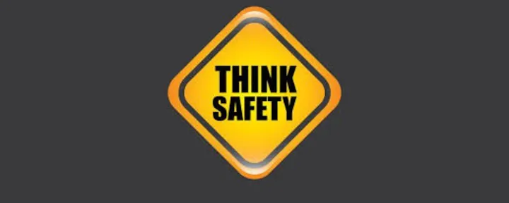 The image features a yellow diamond-shaped sign with the words "THINK SAFETY" prominently displayed.