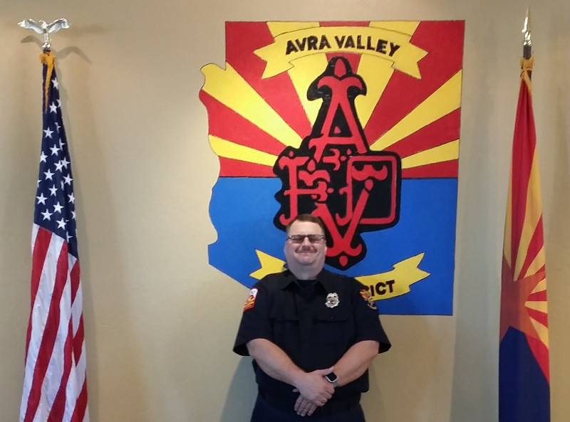 May contain: face, head, person, photography, portrait, adult, male, man, flag, officer, and police officer
