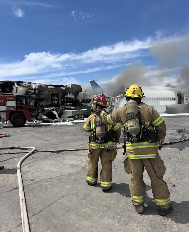 Firefighters respond to a n airplane fire.