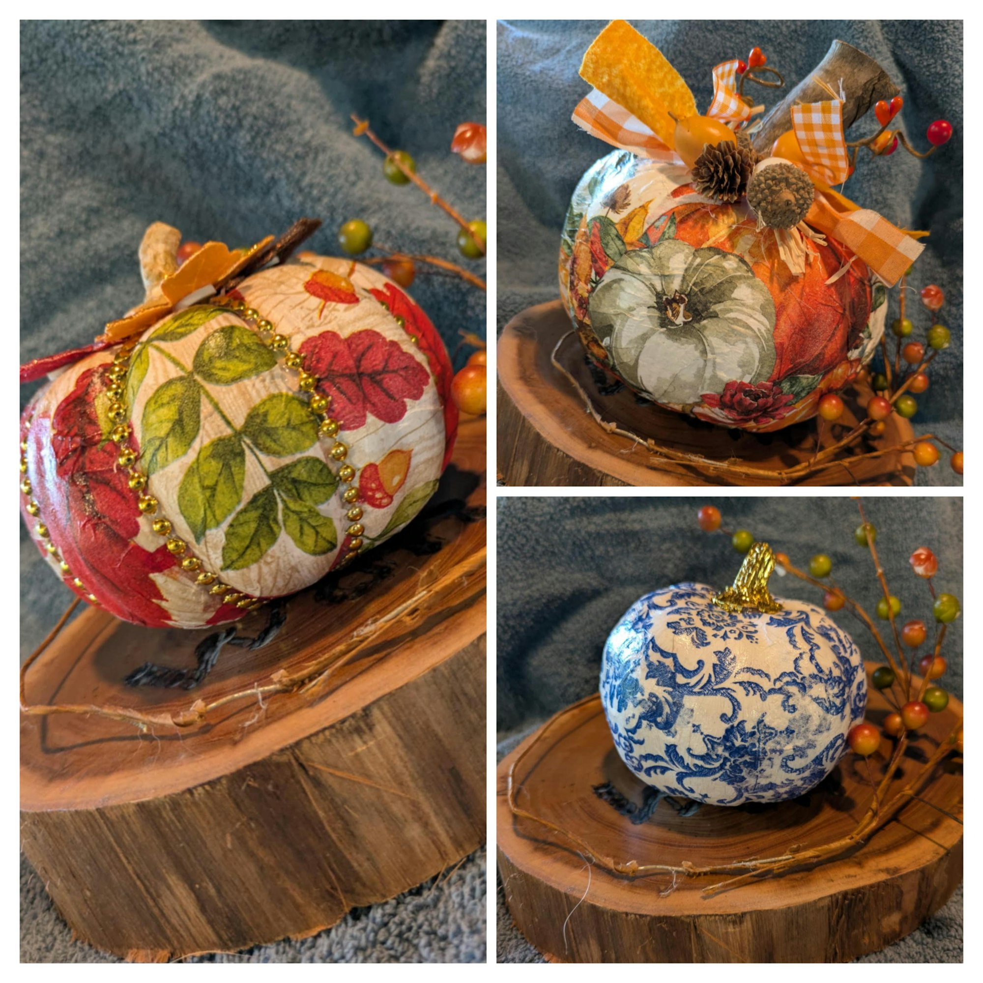 Decorative pumpkins with floral and leaf designs on wood slabs, adorned with bows and berries.