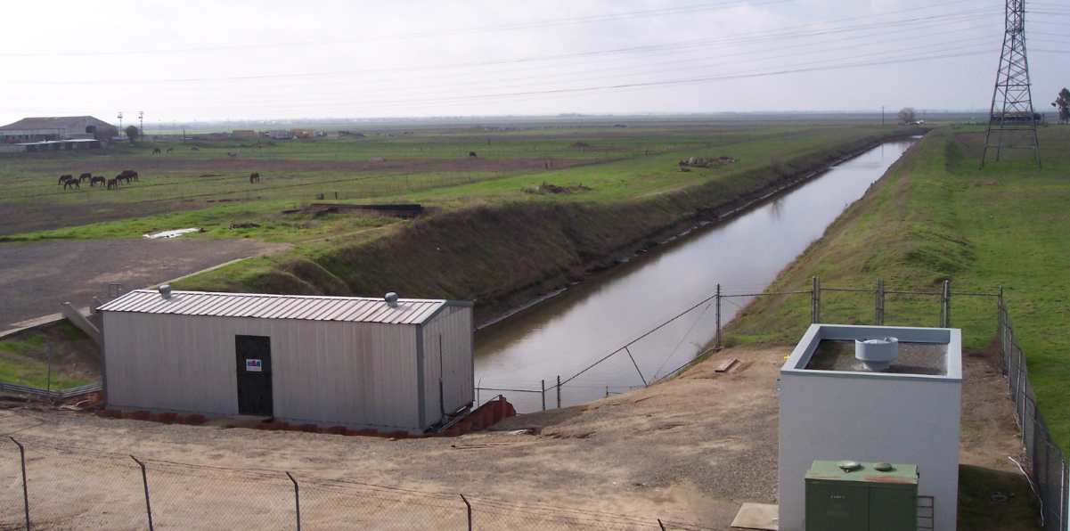 May contain: outdoors, architecture, building, shelter, ditch, water, nature, and canal