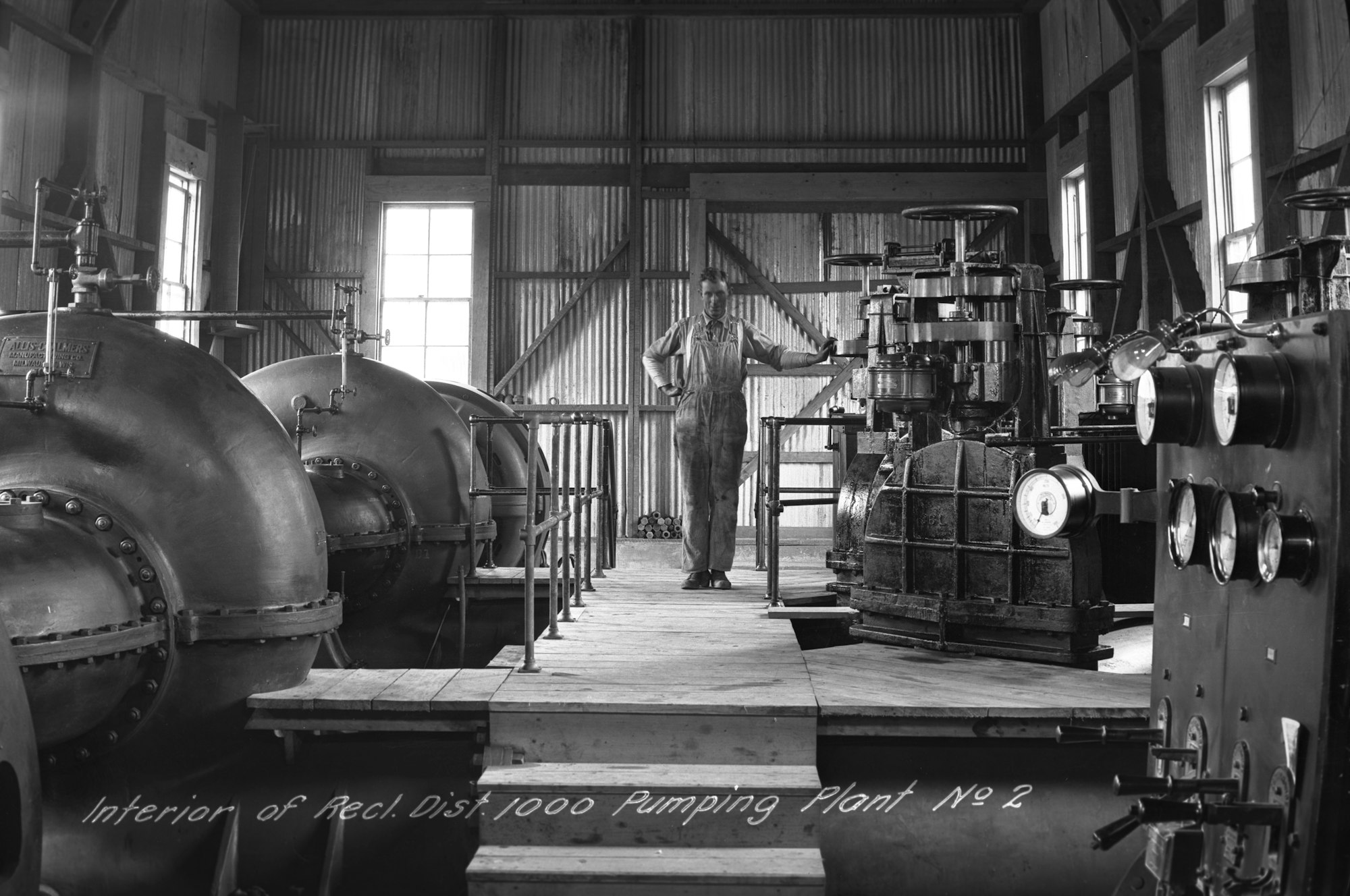 May contain: architecture, building, factory, brewery, adult, male, man, and person