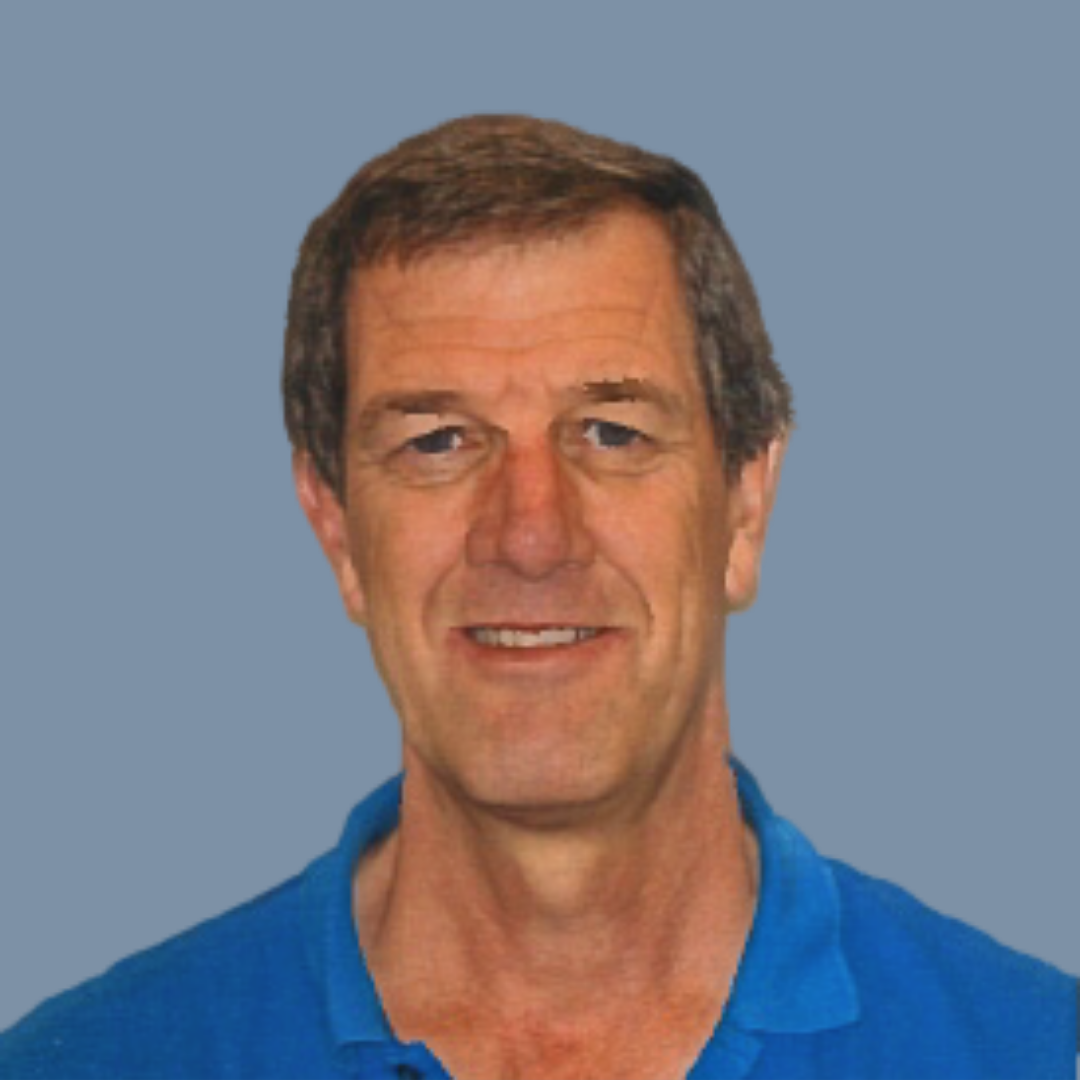 Caucasian man with brown hair wearing blue polo shirt on blue background