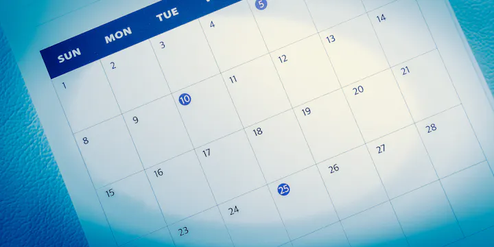 A calendar page showing dates with specific highlights on the 10th and 25th.
