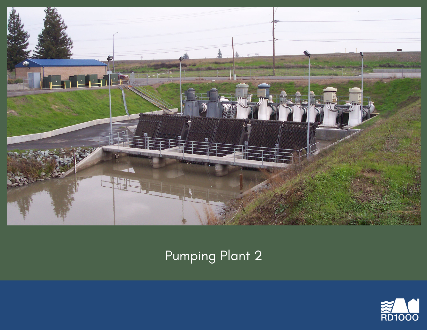 The image shows a pumping plant with several large pumps, a water basin, and a maintenance building on a grassy area.
