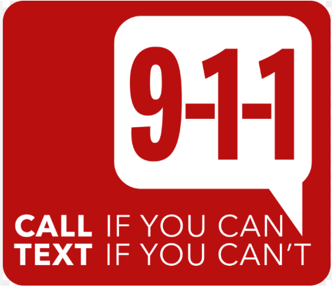 A red sign instructing to call 9-1-1 if possible and to text if calling isn’t an option.