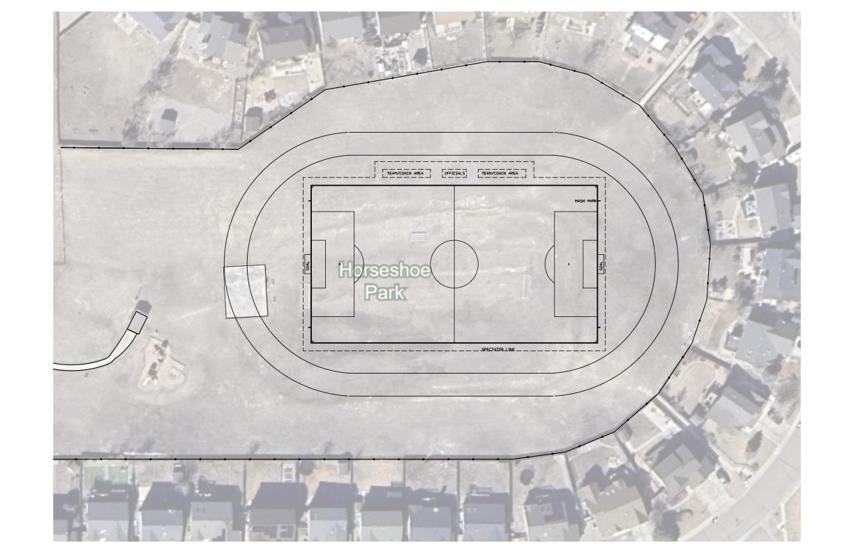 Aerial view of Horseshoe Park, with a marked soccer field, spectator area, and neighborhoods surrounding.