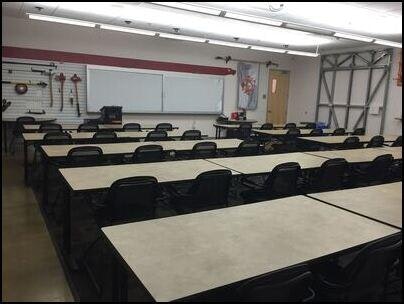 May contain: people, person, architecture, building, school, classroom, indoors, and room