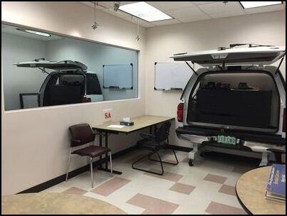 May contain: clinic, indoors, license plate, transportation, vehicle, furniture, and white board