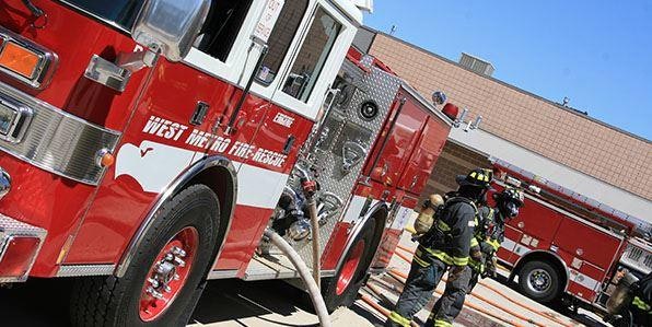 Fire apparatus with firefighters during training