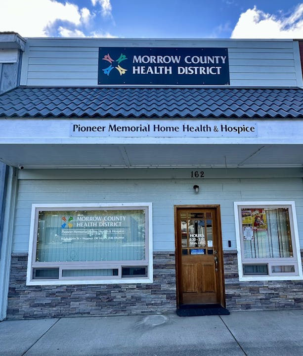 The exterior of the Morrow County Health District building, featuring signage for home health and hospice services.