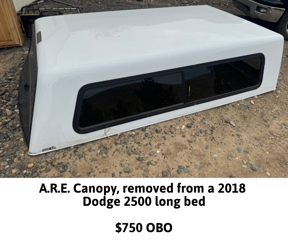 A white A.R.E. canopy from a 2018 Dodge 2500 long bed, for sale at $750 OBO.
