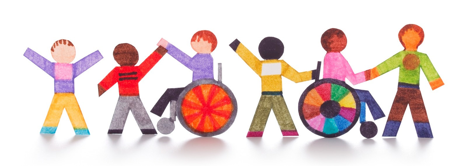 Cut-out figures holding hands, two in wheelchairs, promoting diversity and inclusion.