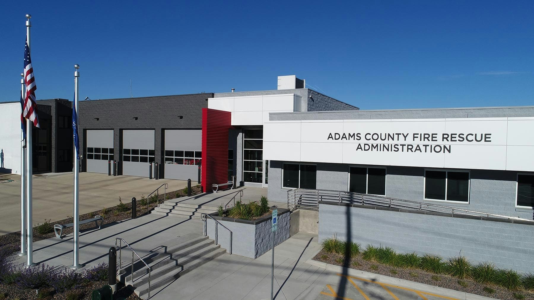 Adams County Fire Rescue Administration building with flagpoles and a modern design.