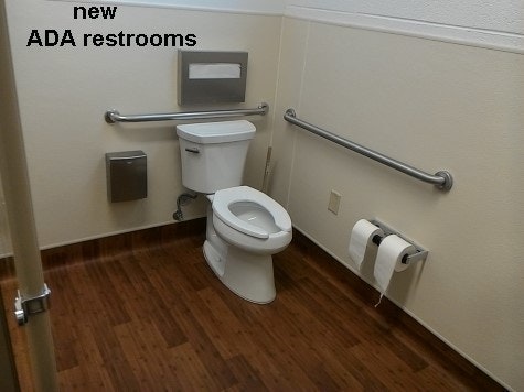 inside updated community building showing new ADA toilet in new restroom.