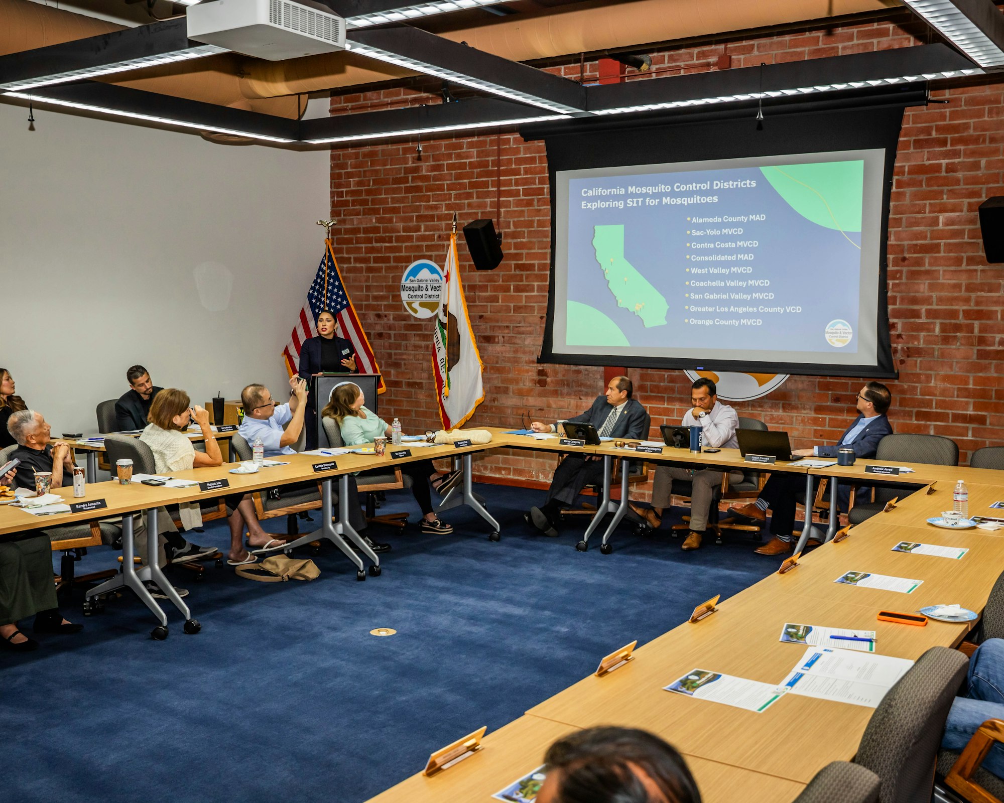 A meeting about California mosquito control districts discussing strategies for managing mosquito populations.