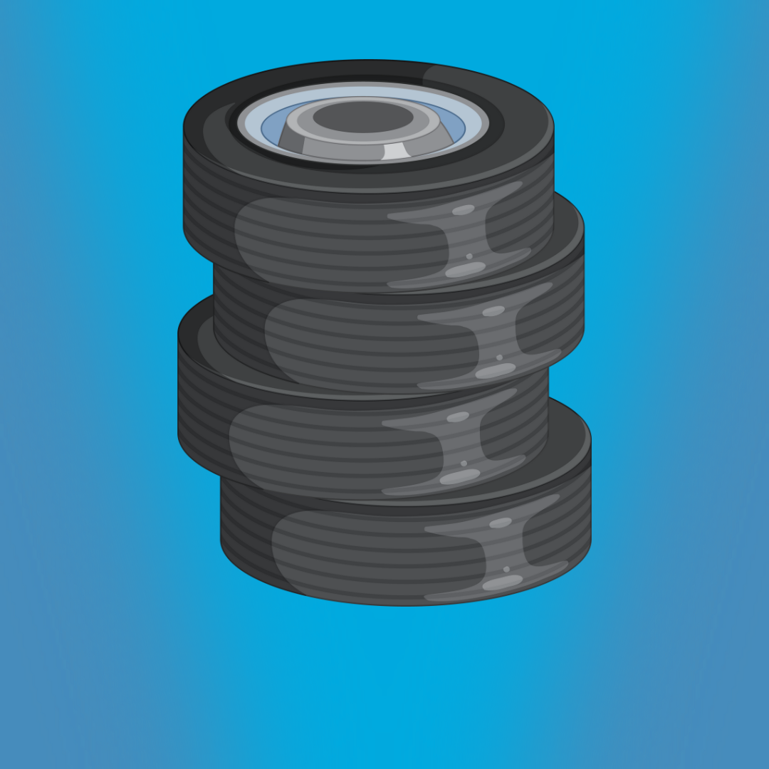 Stack of car tires on a blue background.