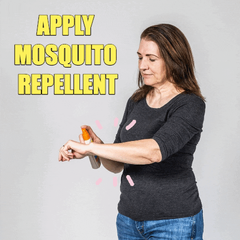 person applying mosquito repellent