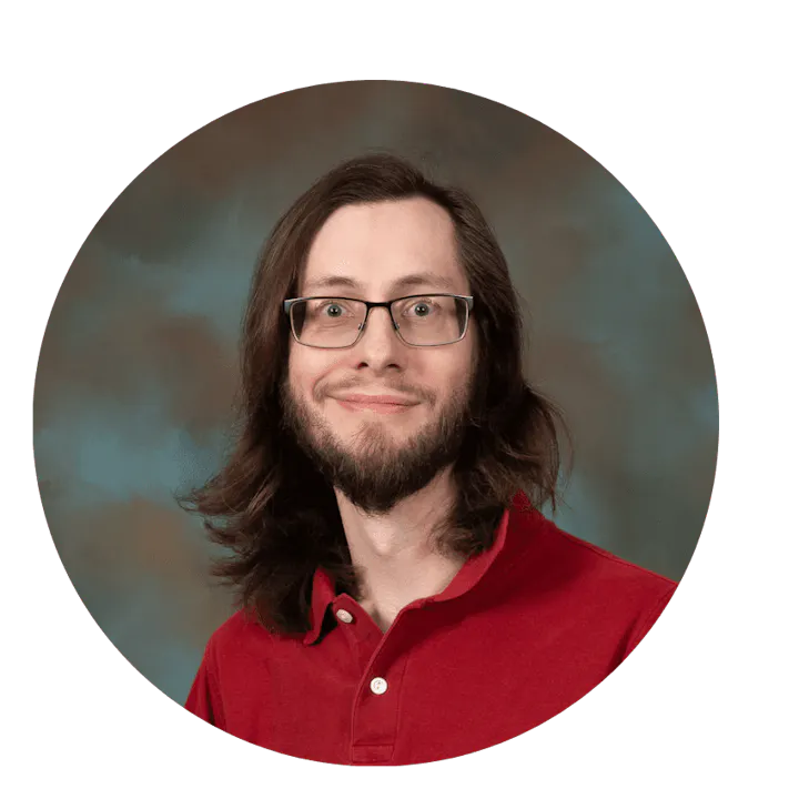 The image features a person with long hair and glasses smiling, wearing a red shirt, with a blurred background in a circular frame.