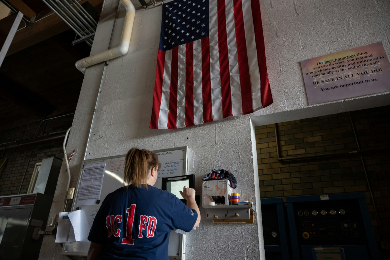 May contain: person, architecture, building, clothing, t-shirt, american flag, and flag