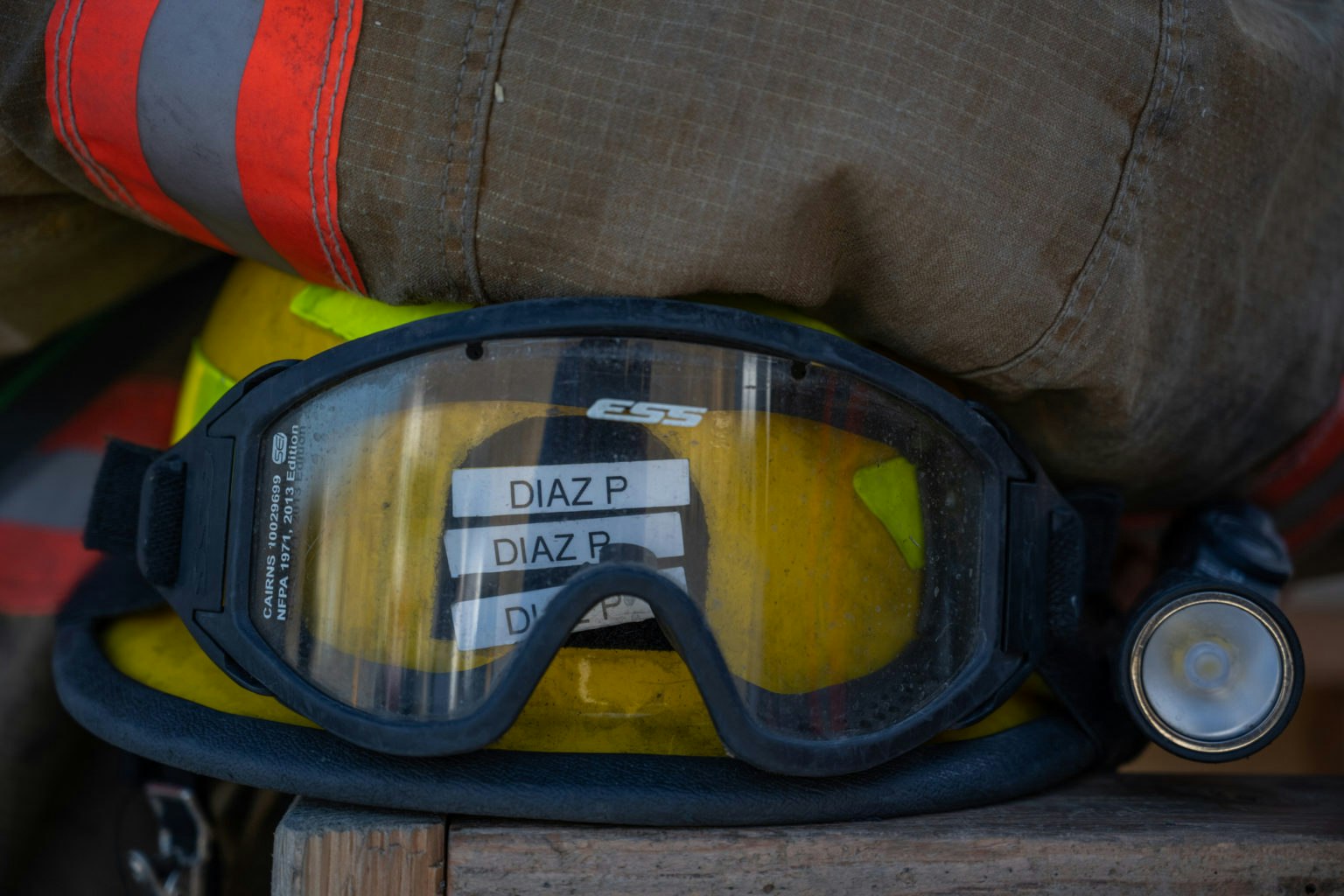 May contain: accessories, goggles, clothing, hardhat, and helmet