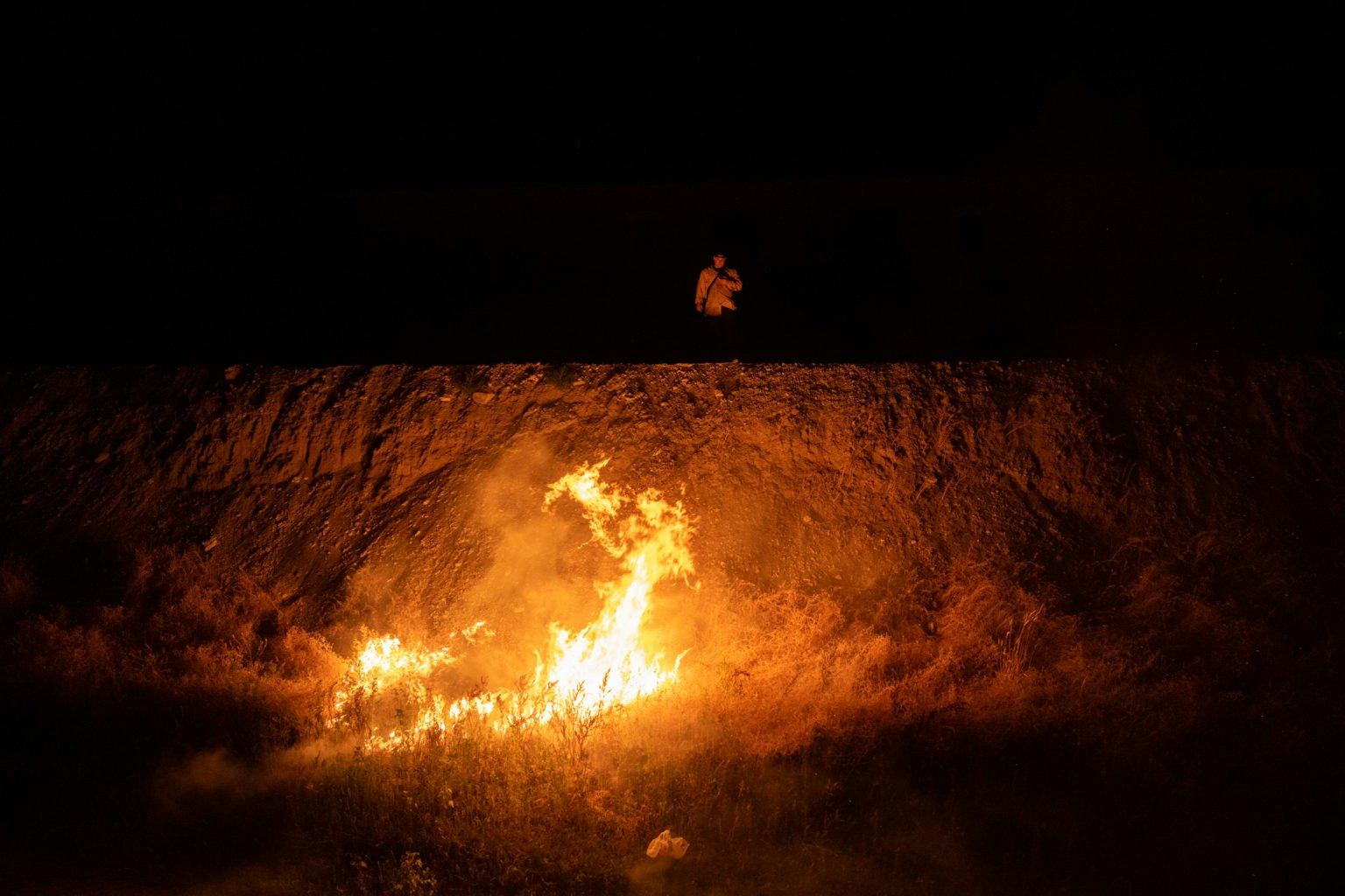 May contain: fire, flame, and person