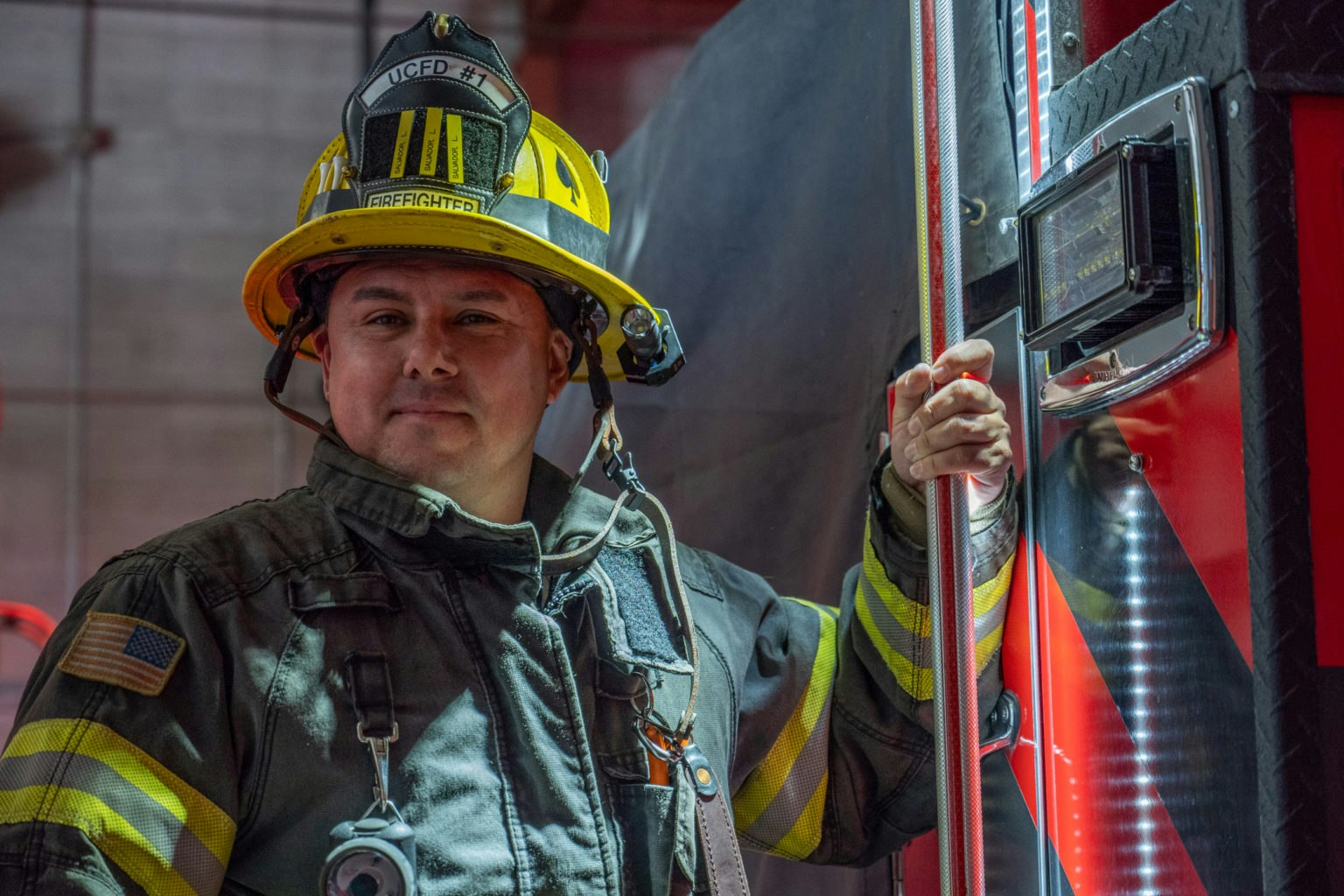 May contain: fireman, person, adult, male, man, helmet, clothing, coat, jacket, face, and head