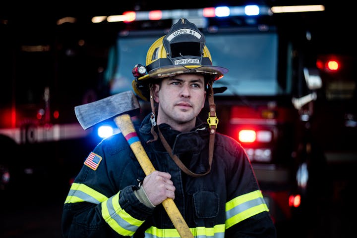 May contain: fireman, person, axe, device, tool, and weapon