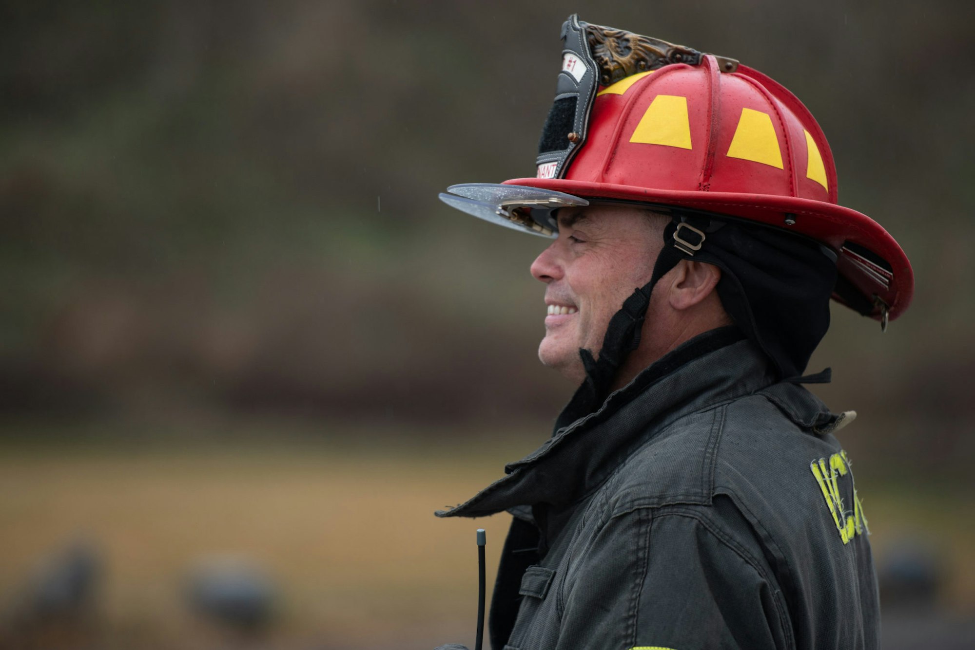 May contain: clothing, hardhat, helmet, adult, male, man, person, and fireman