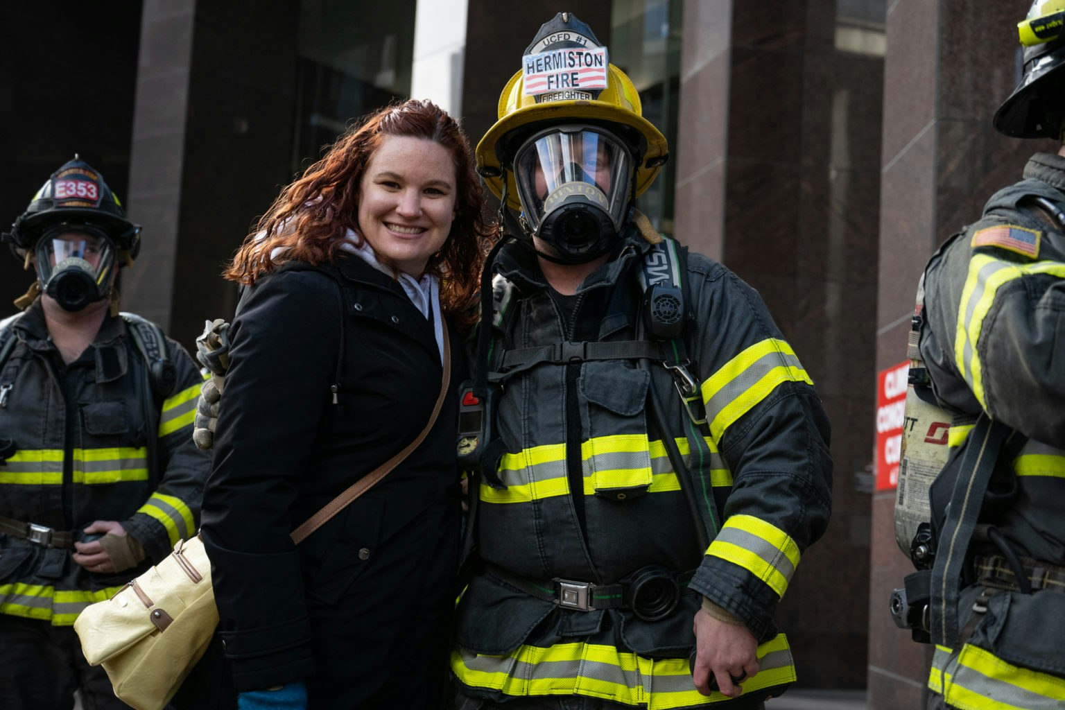 May contain: helmet, adult, male, man, person, face, head, fireman, clothing, coat, and jacket