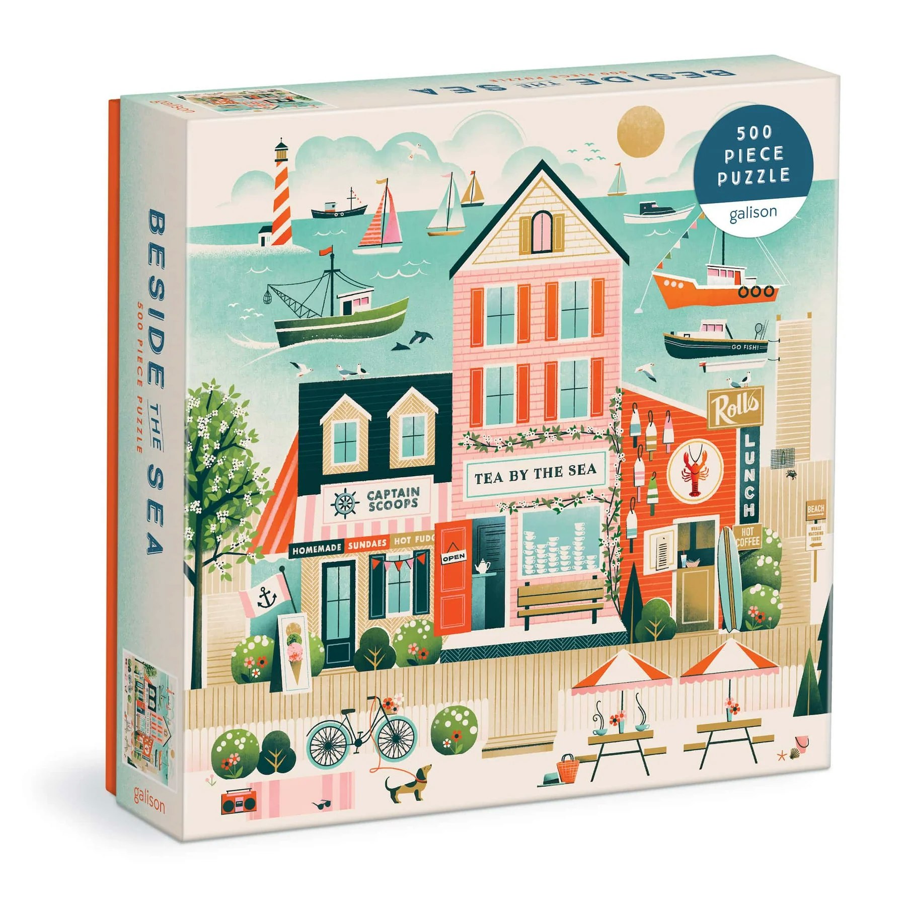 A 500-piece seaside-themed puzzle box featuring boats, buildings, and a lighthouse.