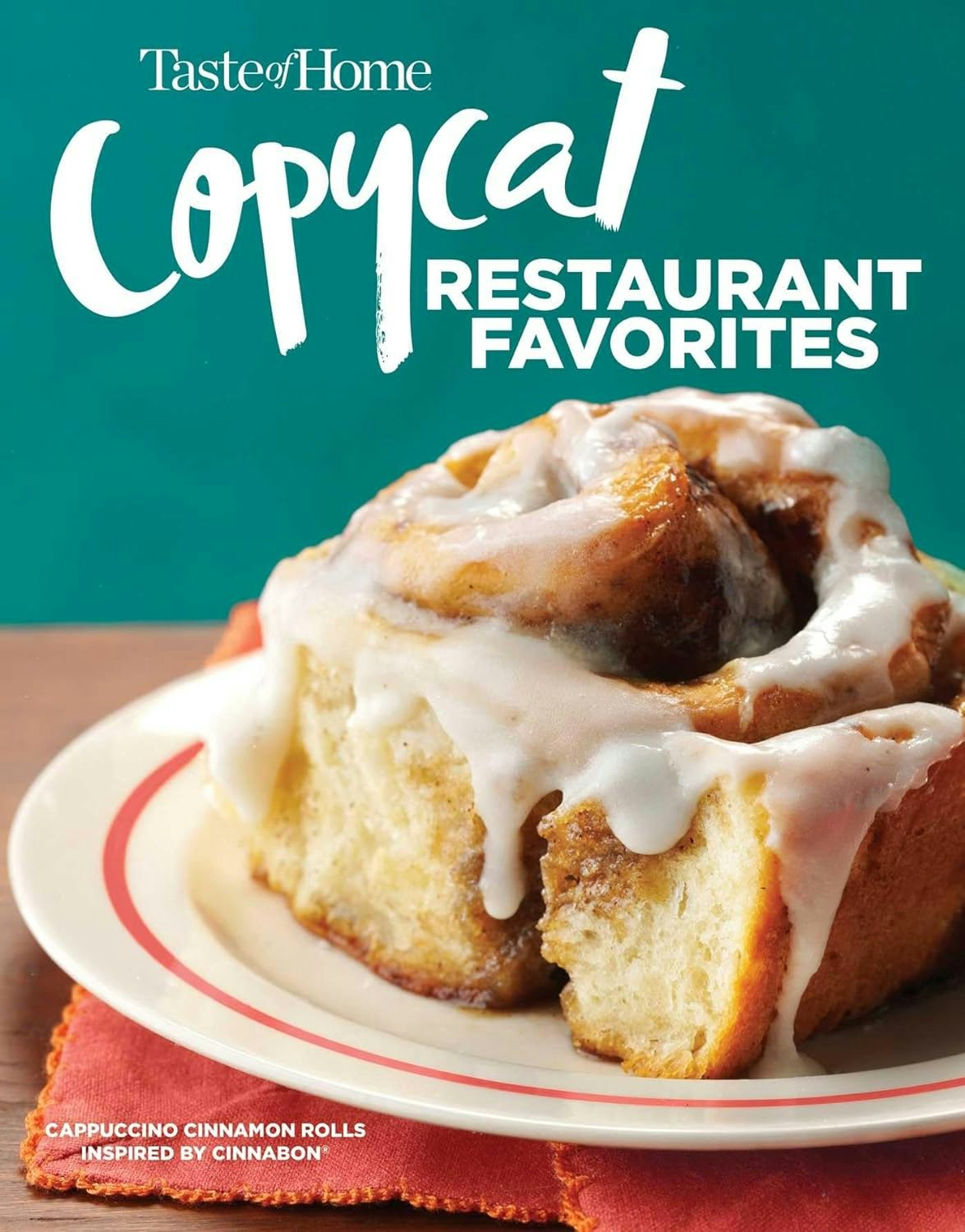 A magazine cover showing a cinnamon roll with icing, titled "Copycat Restaurant Favorites" by Taste of Home.