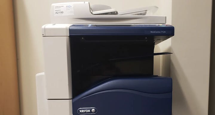 A Xerox WorkCentre 7120 office printer against a wall.