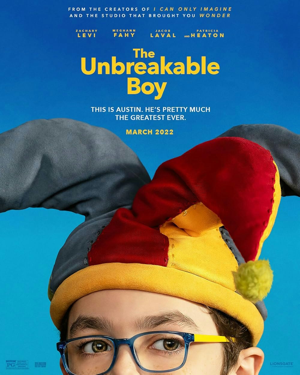 Poster for "The Unbreakable Boy" featuring a child with glasses and a colorful jester hat. Release date: March 2022.