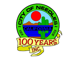 City of Needles, California emblem celebrating 100 years (1913-2013) with a cactus, mountains, and sun design.