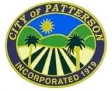 Seal of the City of Patterson, showing a sun, hills, palm trees, and fields, with "Incorporated 1919."