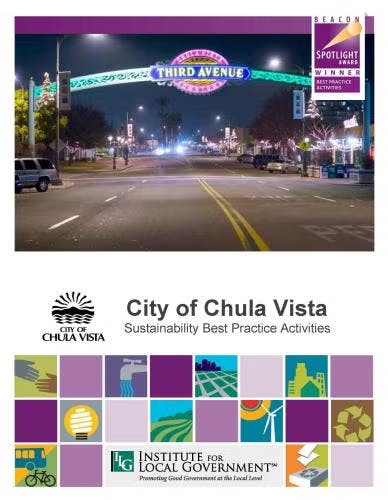 City of Chula Vista sign with award recognition for sustainability practices; features street view and institution logos.