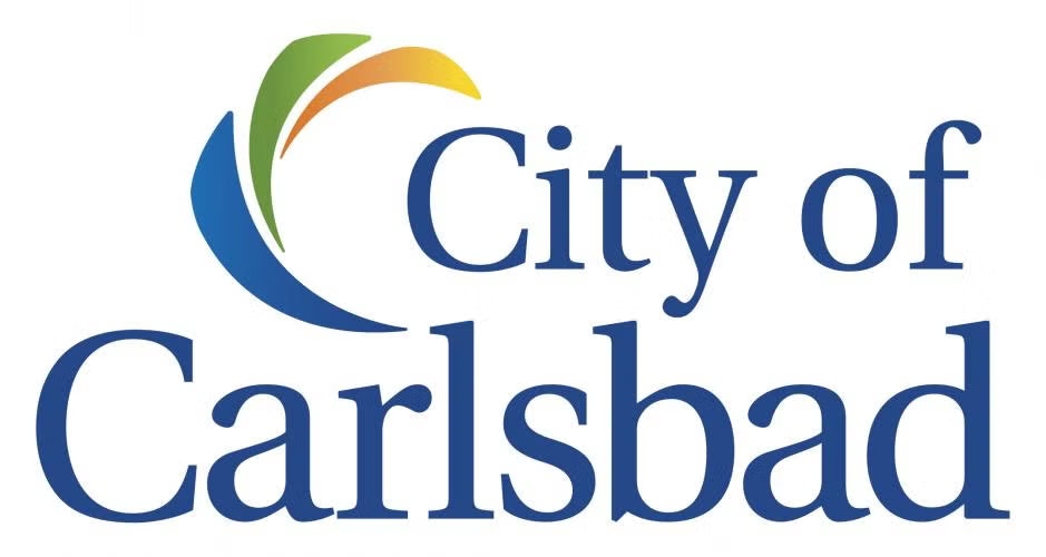 Logo with "City of Carlsbad" text and a colorful swirl design.
