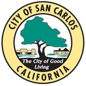Seal of San Carlos, California featuring a tree, buildings, and text: "The City of Good Living."