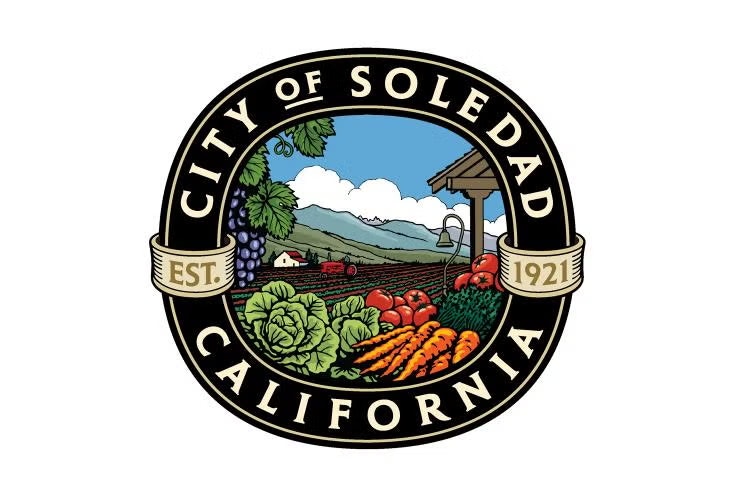 Seal of Soledad, California with farm scenery, vegetables, and grapes, established 1921.