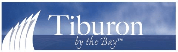 Logo with "Tiburon by the Bay™" in white text on a blue background with sail-like graphics.