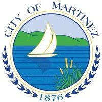 Seal of the City of Martinez featuring a sailboat on water with green hills, surrounded by text and decorative laurel branches.