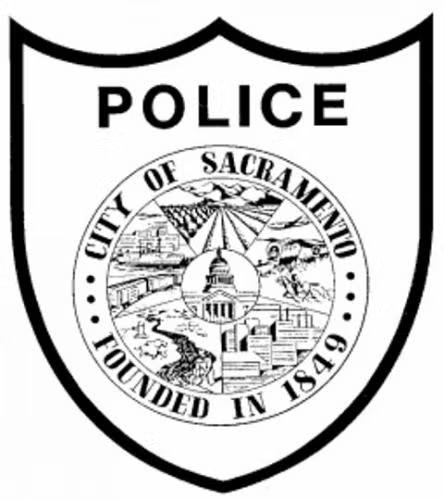 Emblem of Sacramento Police Department, featuring "City of Sacramento Founded in 1849" with scenic imagery and "POLICE" text.
