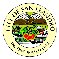 City of San Leandro seal with mountains, sun, a cityscape, and cherries. Incorporated 1872.