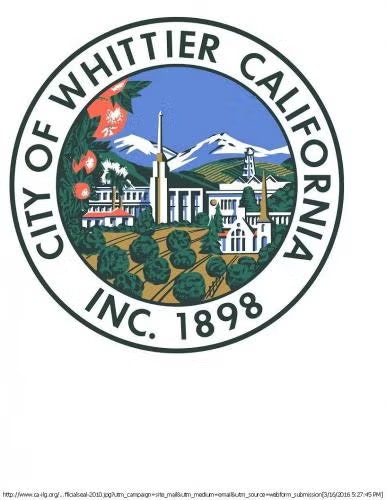 Seal of Whittier, California, featuring mountains, buildings, trees, and the text "City of Whittier California Inc. 1898."
