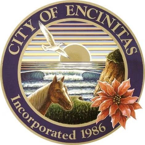 Seal of Encinitas featuring a horse, ocean waves, sunset, seagull, and poinsettia; text reads "City of Encinitas Incorporated 1986."