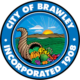 The image shows the seal of Brawley, featuring a cornucopia with fruits and vegetables, symbolizing agriculture and community.