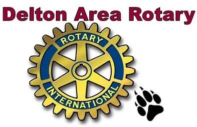 Rotary wheel with "Delton Area Rotary" text and a paw print beside it.